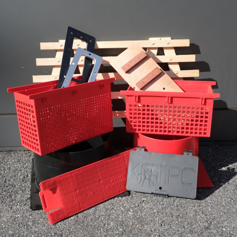 A pile of red crates and wood blocks.